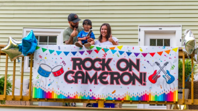 Cam receives a drum set with his parents