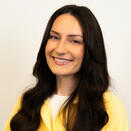 Clare smiling in a photo