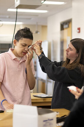 Jayden tests a prototype of an eye patch