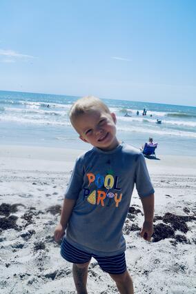 Knox smiling at the beach in Florida