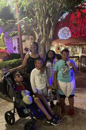 Demetrics enjoying the lights at Give Kids The World