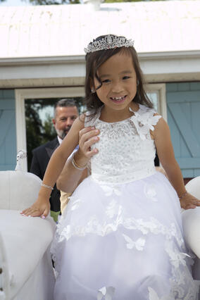 Journi getting into her horse drawn carriage at her princess ball