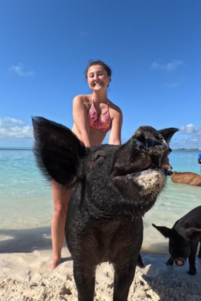 Addison swims with pigs portrait
