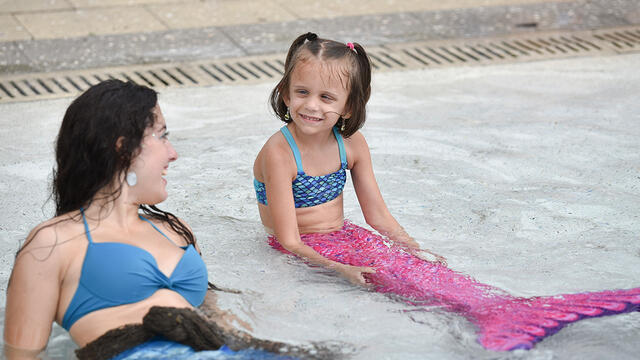 Lilli smiling at her new fins