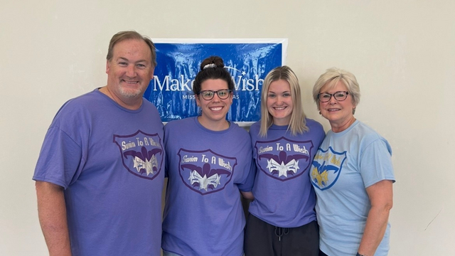 Aubrey and her family at Swim for a Wish